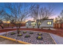 Charming home featuring xeriscaped yard with native plants and decorative rock at 1731 Sherwin Ln, Las Vegas, NV 89156