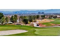 Scenic golf course view showcasing lush green fairways and distant city skyline at 2521 Roseworthy Dr, Las Vegas, NV 89134