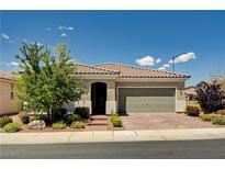 Charming single-story home with a well-maintained front yard and a brick driveway at 2902 Ventana Ridge Ave, Henderson, NV 89044