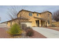 Charming two-story home showcasing a neutral color, two-car garage, and well-maintained landscaping at 3938 E Chaffe Ave, Pahrump, NV 89061