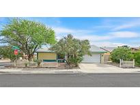 Charming single-story home with a well-manicured lawn and a welcoming front entrance at 3989 Parkhaven Dr, Las Vegas, NV 89120