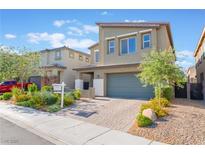 Charming two-story home featuring a manicured yard, two-car garage, and inviting curb appeal at 4524 Stardusk Falls Ave, North Las Vegas, NV 89084