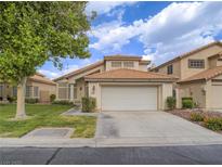 Charming single-Gathering home boasting a well-manicured lawn and a two-car garage at 5452 Big Sky Ln, Las Vegas, NV 89149