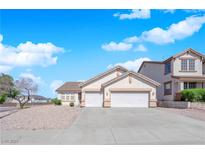 Charming single Gathering home with a three-car garage and mature landscaping at 82 Autumn Day St, Henderson, NV 89012