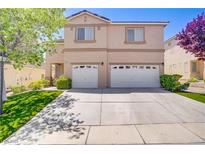 Charming two-story home with two-car garage and a well-manicured lawn at 8913 Loggers Mill Ave, Las Vegas, NV 89143