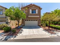 Two-story home featuring a neutral exterior, a two-car garage, mature trees and landscaped front yard at 9537 Michelle Falls Ave, Las Vegas, NV 89149