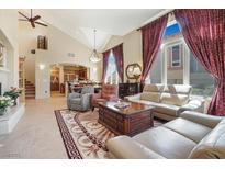 Spacious living room with high ceilings, a fireplace, and comfortable seating at 1 Cerchio Basso, Henderson, NV 89011