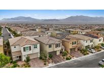 Expansive aerial view of a community with a stunning mountain backdrop at 10324 Stroma Ave, Las Vegas, NV 89166
