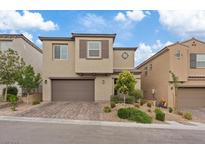 Charming two-story home featuring a brick driveway and well-manicured landscaping at 10324 Stroma Ave, Las Vegas, NV 89166