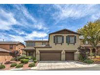 Two-story home boasts a multi-car garage, complemented by charming shutters and landscaped front yard at 10623 Auburn Springs Ave, Las Vegas, NV 89166