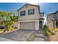 Charming two-story home with a two-car garage and paved driveway at 1637 Harvest Pecan Ct, Las Vegas, NV 89108