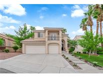 Charming two-story home featuring a spacious three-car garage and landscaped front yard with walkway at 2257 Norway Pine Ct, Las Vegas, NV 89134