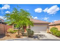 Charming home with a well-maintained front yard and a spacious two-car garage at 2920 Riarosa Ct, North Las Vegas, NV 89086