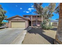 Charming two-story home featuring a large front yard and a two-car attached garage at 3018 Burnham Ave, Las Vegas, NV 89169