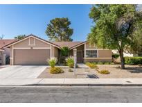 Charming single-story home features desert landscaping and attached two-car garage at 368 Umbria Way, Henderson, NV 89014