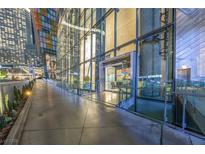 Modern building entrance featuring a sleek glass facade and well-lit walkway at 3722 Las Vegas Blvd # 2509, Las Vegas, NV 89158