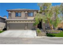 Charming two-story home featuring a three-car garage, landscaped front yard, and inviting entryway at 3728 Richard Allen Ct, Las Vegas, NV 89147
