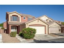 Charming two-story home features a two-car garage and low-maintenance landscaping at 5573 La Perla Ct, Las Vegas, NV 89122