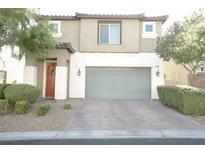 Charming two-story home featuring a two-car garage, landscaped front yard, and inviting curb appeal at 5941 Galway Bay St, North Las Vegas, NV 89081