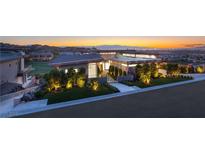 Stunning contemporary home featuring professional landscaping and city views at 641 Majestic Rim Dr, Henderson, NV 89012