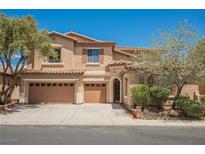 Charming two-story home featuring a three-car garage, desert landscaping, and a tile roof at 8244 Cupertino Heights Way, Las Vegas, NV 89178