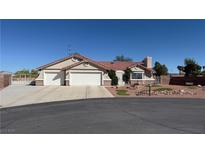 Charming single story home with a three car garage, well manicured landscape, and a tile roof at 9180 Mohawk St, Las Vegas, NV 89139