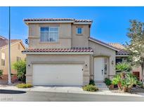 Inviting two-story home featuring a tile roof, attached two-car garage, and mature landscaping at 10372 Timber Canyon Ave, Las Vegas, NV 89129