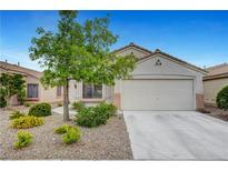 Charming single-story home featuring desert landscaping, a two-car garage, and a cozy, inviting facade at 10929 Vallerosa St, Las Vegas, NV 89141