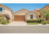Charming single-story home featuring a well-manicured front yard and a two-car garage at 12426 Mosticone Way, Las Vegas, NV 89141