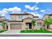 Charming two-story home featuring a stone facade, desert landscaping, and a spacious two-car garage at 350 Gandara St, Las Vegas, NV 89138