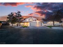 Charming two-story home features a well-maintained front yard and a spacious three-car garage at 4061 W Eldorado Ln, Las Vegas, NV 89139