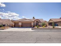 Charming single-story home featuring a three-car garage, desert landscaping, and a tile roof at 5441 Rose Hills St, Las Vegas, NV 89149