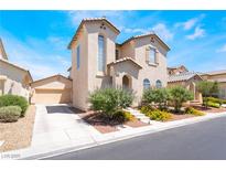 Inviting two-story home with desert landscaping and attached two car garage at 5854 Willow Trace Ave, Las Vegas, NV 89139