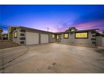 Charming single-story home with a spacious driveway and a two-car garage at 6244 Parsifal Pl, Las Vegas, NV 89107