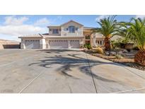 Expansive home boasts a generous six-car garage and meticulously maintained desert landscaping at 6999 Stone Meadows Ave, Las Vegas, NV 89142