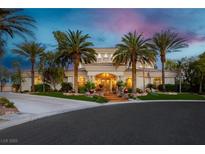 Elegant estate boasting lush landscaping and mature palm trees at 7625 Coley Ave, Las Vegas, NV 89117
