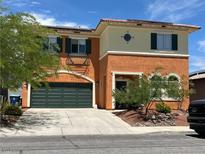 Charming two-story home features a two-car garage and stucco exterior with beautiful landscaping at 7920 Aviano Pines Ave, Las Vegas, NV 89129