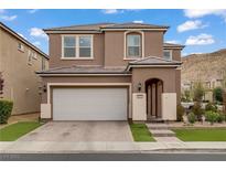 Charming two-story home showcasing a neutral color scheme, attached garage, and well-manicured landscaping at 9557 Belmont Bay Ave, Las Vegas, NV 89148