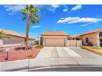 Charming single-story home with a well-maintained front yard and a spacious two-car garage at 1057 Neil Armstrong Cir, Las Vegas, NV 89145