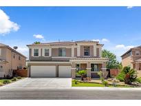Charming two-story home featuring a two-car garage, landscaped front yard, and inviting curb appeal at 2117 Mountain Rail Dr, North Las Vegas, NV 89084