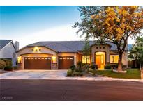 Beautiful single-story home features a three-car garage and well-manicured landscaping at 2547 Serenity Hollow Dr, Henderson, NV 89052