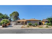 Charming single-story home featuring a low-maintenance yard, covered entry, and spacious driveway at 6225 Rassler Ave, Las Vegas, NV 89107