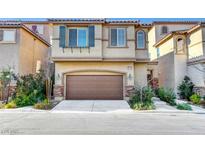 Inviting two-story home featuring an attached two-car garage and well-manicured landscaping at 10735 Galveston Bay St, Las Vegas, NV 89179