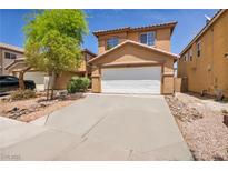 Inviting two-story home with a well-maintained front yard and an attached two-car garage at 3232 Brayton Mist Dr, North Las Vegas, NV 89081