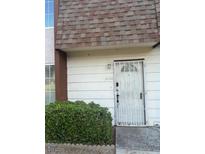 Home featuring front door with security gate, and a well-manicured bush at 3692 Garden South Dr # 0, Las Vegas, NV 89121