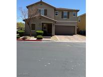 Charming two-story home features a well-manicured lawn and a two car garage at 3855 Park Field Dr, Las Vegas, NV 89120