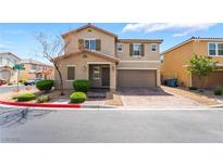 Inviting two-story home featuring desert landscaping and a brick paved driveway to a two car garage at 3855 Park Field Dr, Las Vegas, NV 89120