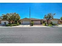 Charming single-story home features a tile roof, a two-car garage and low maintenance landscaping at 4802 Regalo Bello St, Las Vegas, NV 89135