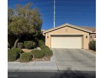 Charming single-story home featuring a two-car garage, desert landscaping, and a welcoming entrance at 4802 Regalo Bello St, Las Vegas, NV 89135