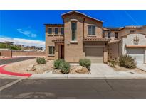 Charming two-story home with well-maintained landscaping and attached garage at 6620 Tulip Falls Dr, Henderson, NV 89011